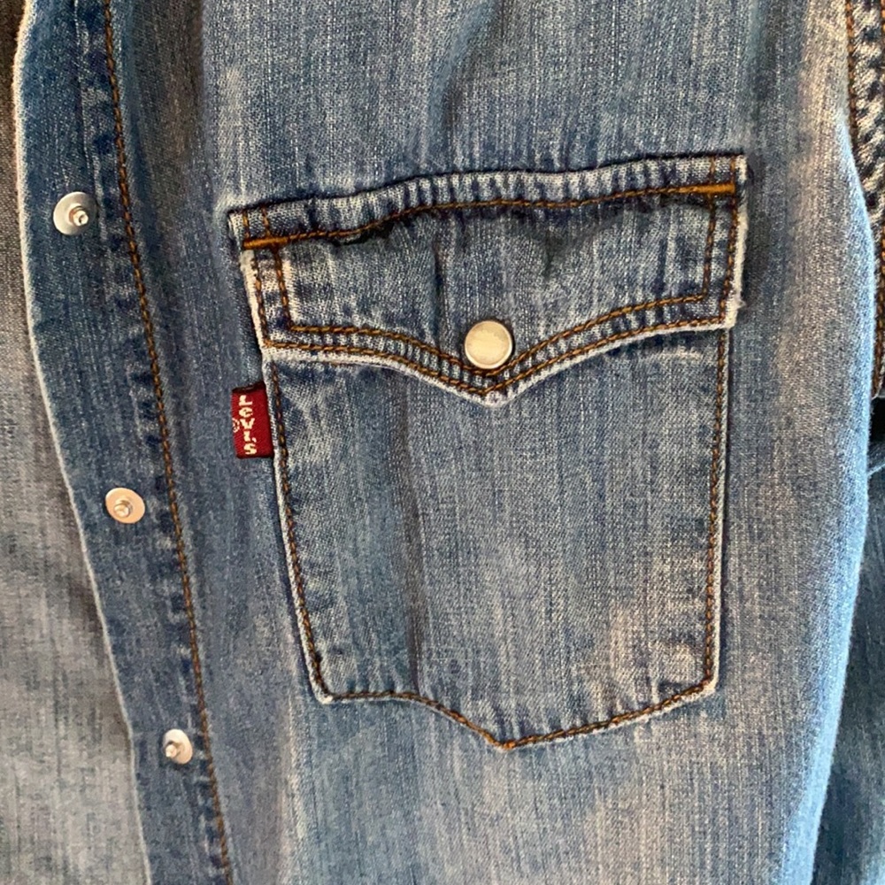 Denim snap shirt. Soft and comfy. Great addition.